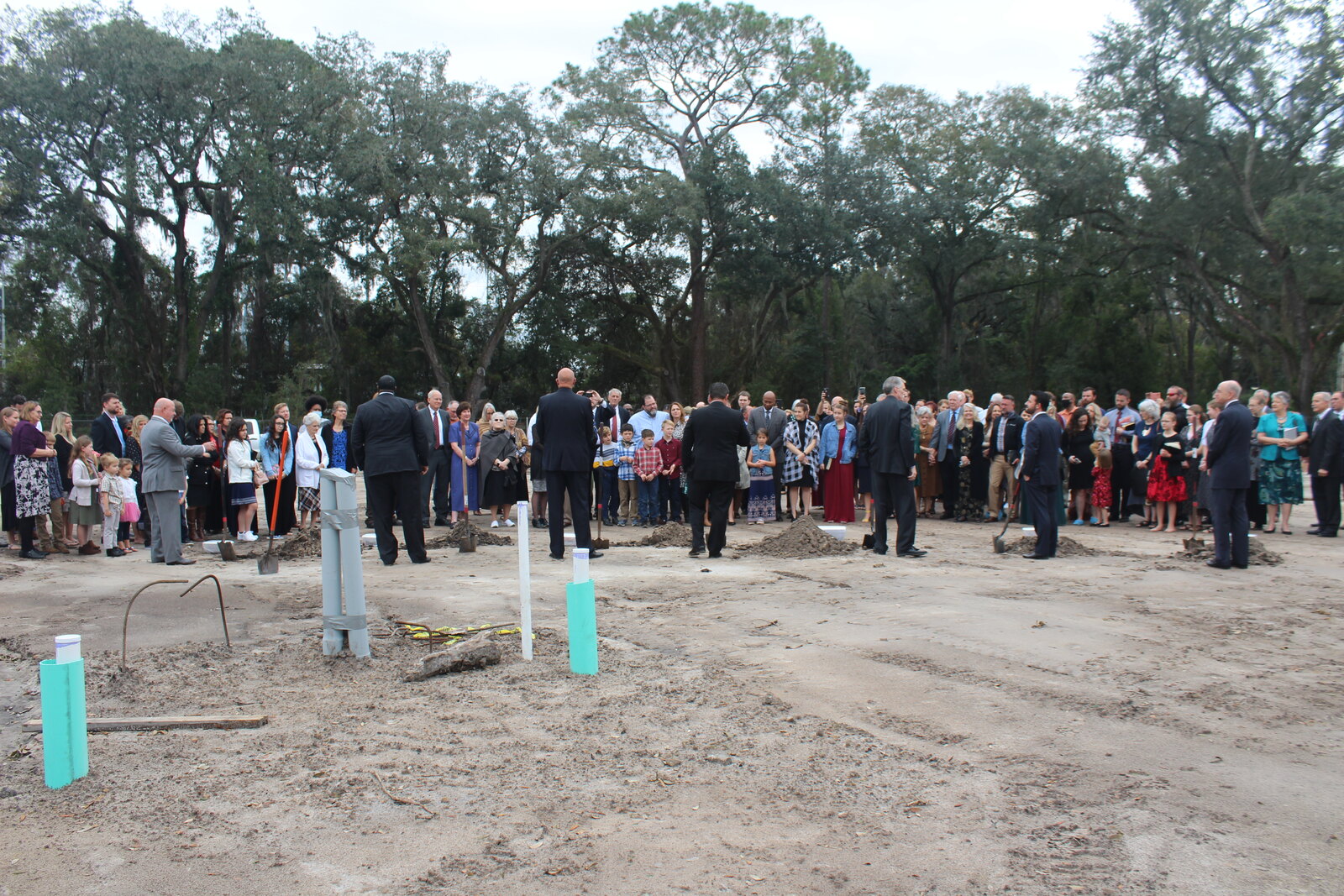 The congregation gathered to pray at the future church building site