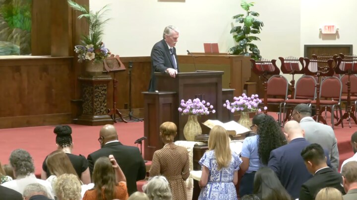 Dr. David Peacock preaching during a service at Bible Believers Baptist Church