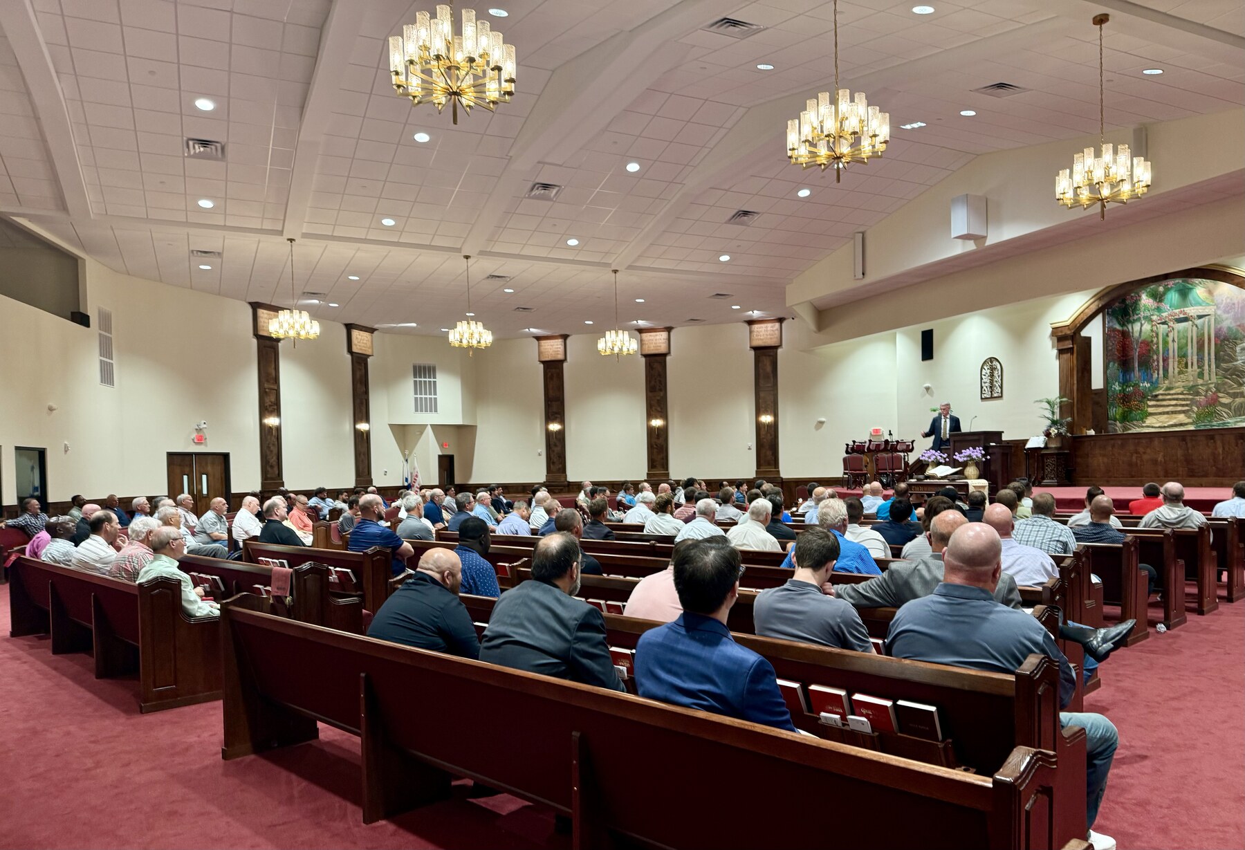 Men gathered in the sanctuary for Bible preaching